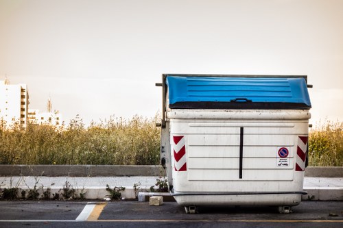 Residents disposing of furniture at a Battersea recycling center